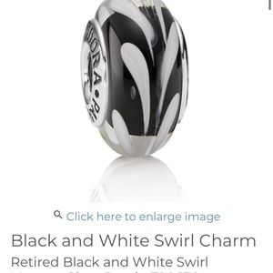 Pandora like new Glass charm white and black. Worn one time on necklace.